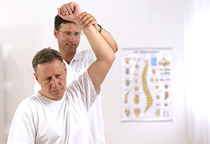 Patient being treated for back pain by physiotherapist